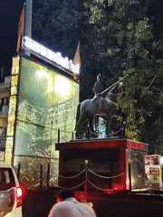 Ganesh Chaturthi night in Thikri — idols, lights, and street stalls