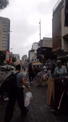 Evening street market activity documented in Caracas district