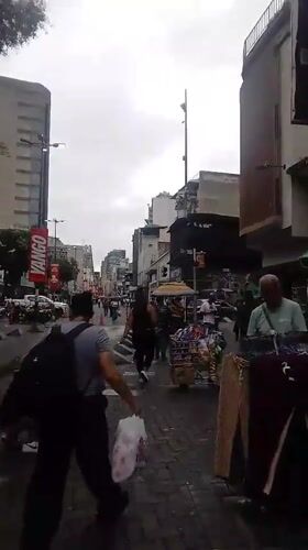 Evening street market activity documented in Caracas district