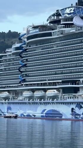 Cruise passengers and locals exchange waves at Montenegro port