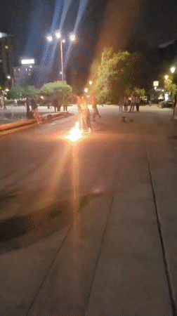 Fire performers entertain crowds at Sofia's National Palace plaza