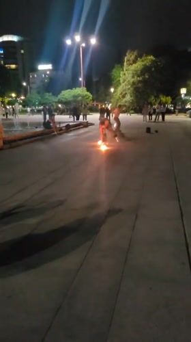 Fire performers entertain crowds at Sofia's National Palace plaza
