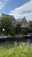 Canal stroll documented with decorative sneakers in Katwijk