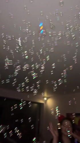 Person catches bubbles in balloon-filled room in Bulgaria