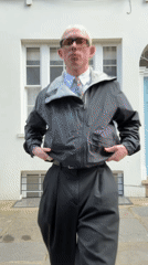 Man poses outside white building in central London