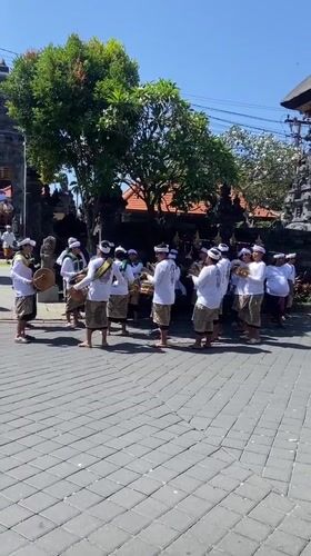 Balinese ceremonial procession winds through Kuta temple streets