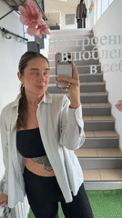 Woman captures multiple selfies in Chaikovsky mirror session