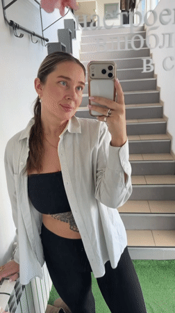 Woman captures multiple selfies in Chaikovsky mirror session
