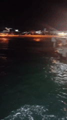 Nighttime water view off the Ketapang coast, lights on the horizon