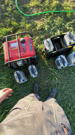 Worker prepares agricultural drone equipment in Bulgarian field