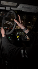 Driver installs steering wheel in car at night in Khimki