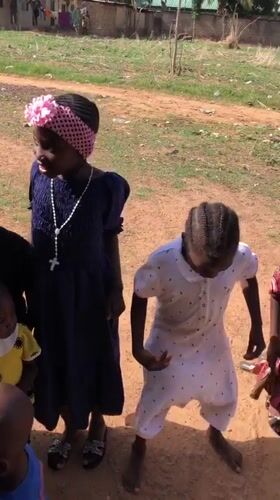 Children gather outdoors in Akwanga, Nigeria