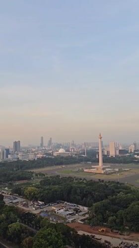 Aerial views capture Jakarta's National Monument amid hazy cityscape