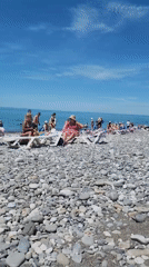 Sunny morning beach scene captured by multiple witnesses
