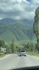 Scenic mountain drive documented in rural Kyrgyzstan