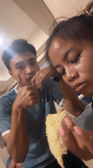 Two people share durian fruit indoors in Central Jakarta