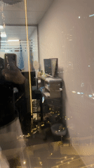 Office worker takes evening selfie against Dubai city lights