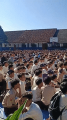 Students gather for outdoor assembly in Indonesian schoolyard