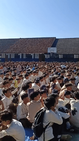Students gather for outdoor assembly in Indonesian schoolyard