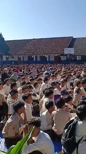 Students gather for outdoor assembly in Indonesian schoolyard