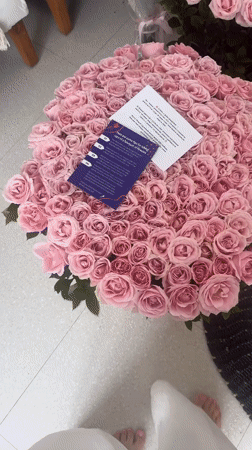 Pink rose bouquets and balloons displayed in North Kuta