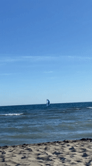 Coastal recreation and camping activities documented during sunny afternoon