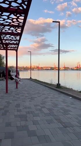 Evening life unfolds along Cherepovets waterfront and city streets