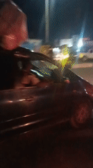 Nighttime traffic flows around Jos coronation monument