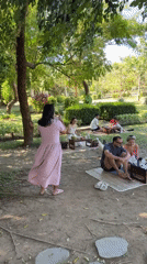 Diners interact with ducks at Indonesian outdoor cafe