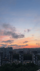 Evening skywatch captures sunset views across Kudrovo, Russia cityscape