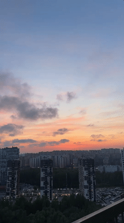 Evening skywatch captures sunset views across Kudrovo, Russia cityscape