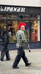 Man with red mohawk spotted walking London sidewalk