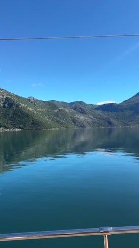 Morning sail captured in peaceful Montenegro bay