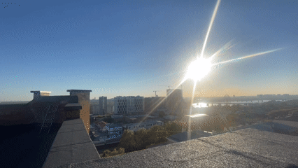 Rooftop sunrise selfie over the Novosibirsk skyline