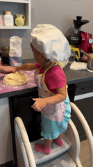Little chef tackles dough-making in a Wisła kitchen