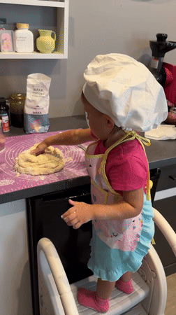 Little chef tackles dough-making in a Wisła kitchen