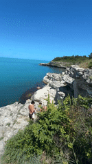Young men gather on cliffs overlooking Black Sea near Tsarevo
