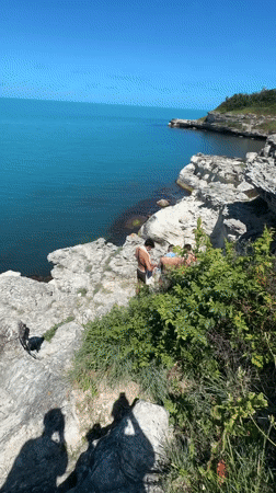 Young men gather on cliffs overlooking Black Sea near Tsarevo