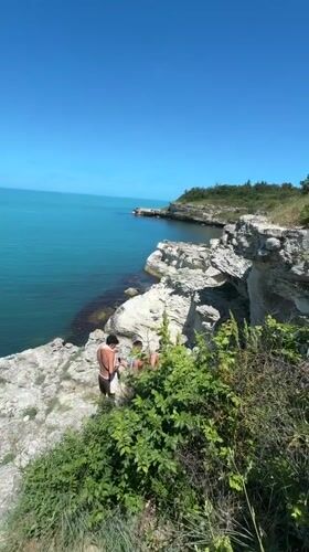Young men gather on cliffs overlooking Black Sea near Tsarevo