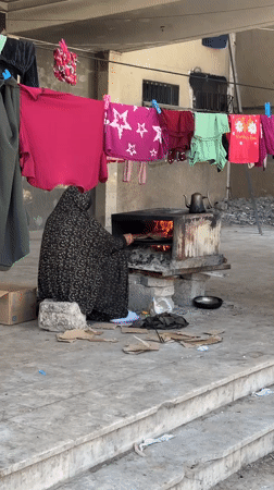 Gaza residents continue daily routines amid damaged buildings