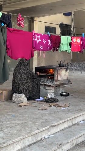 Gaza residents continue daily routines amid damaged buildings