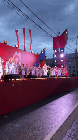 Young dancers perform on decorated outdoor stage in Novosibirsk