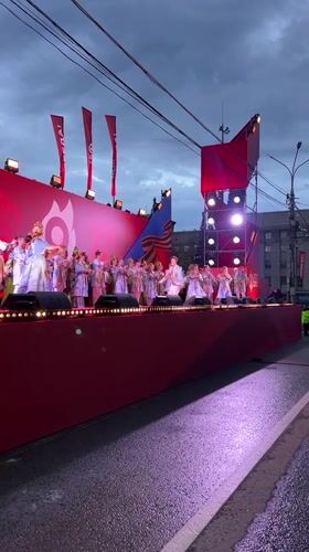 Young dancers perform on decorated outdoor stage in Novosibirsk