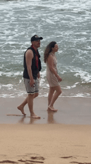 Couple enjoys morning beach walk in Thalaramba, Sri Lanka