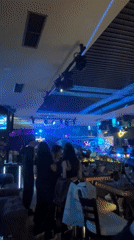Blue-lit nightclub scene documented in Sofia, Bulgaria