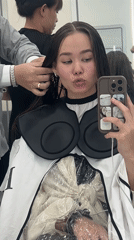Woman takes salon selfies during hair appointment in Nha Trang