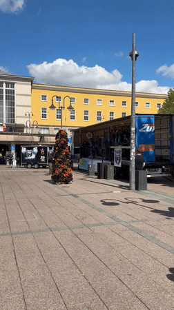 Street band performs on truck stage in Fulda