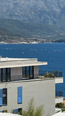 Clear day captures scenic bay view in Bijela, Montenegro