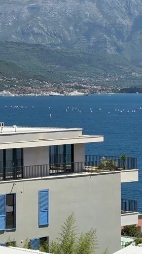 Clear day captures scenic bay view in Bijela, Montenegro