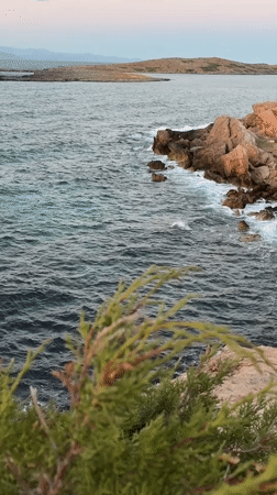 Sunset along the rocky Greek coastline near Athens